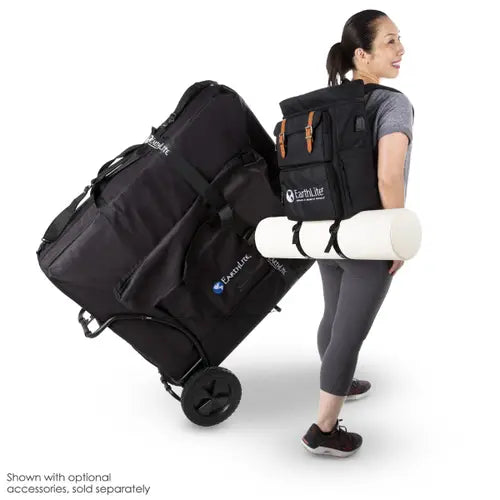 A folded portable massage table securely strapped onto a heavy-duty travel cart frame featuring smooth-gliding, all-terrain transport wheels.