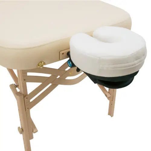 An adjustable professional massage table face cradle attachment with a matching plush black memory foam crescent pillow.