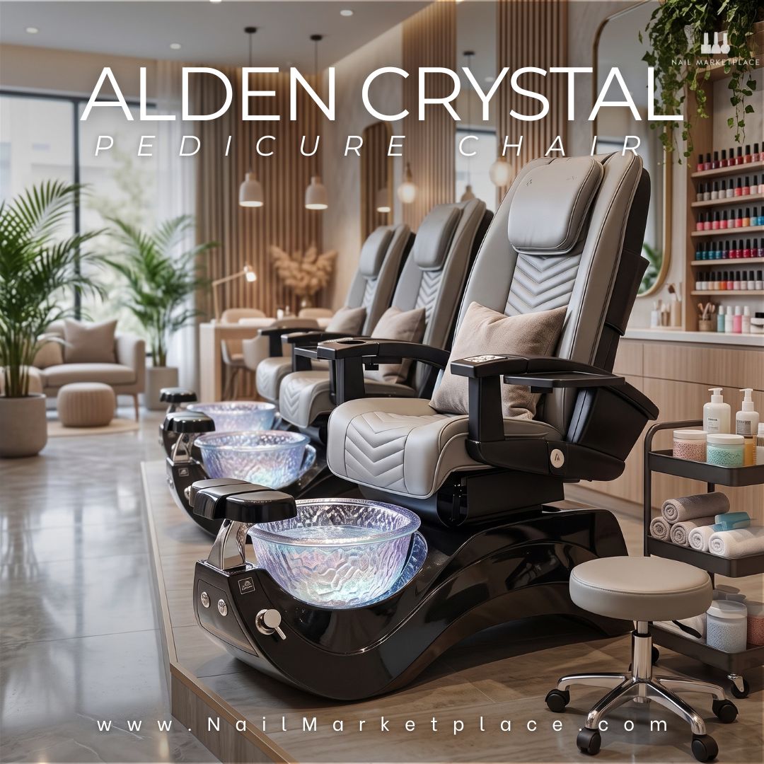 Alden Crystal Pedicure Chair featuring light grey upholstery, a black base, and an iridescent textured glass spa bowl in a modern salon interior.