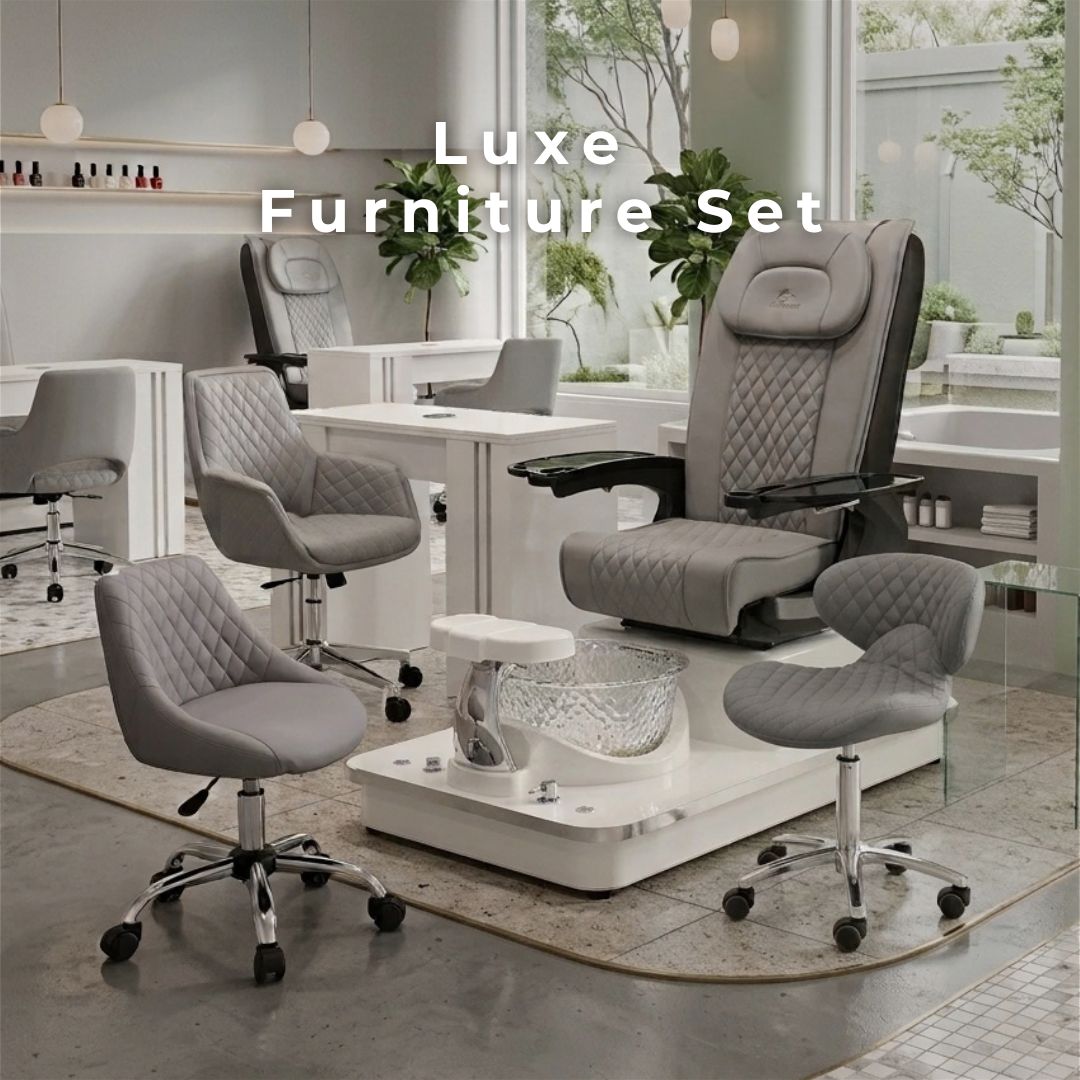 Luxe nail salon furniture set featuring a grey quilted pedicure spa chair with glass basin, matching manicure table, and rolling technician stools.