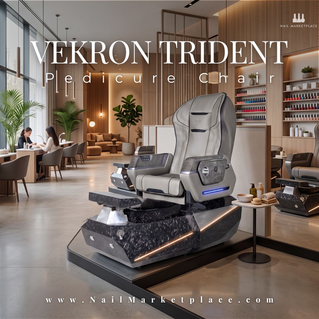 The Vekron Trident Pedicure Chair in a luxurious, modern nail salon, featuring a premium grey massage seat and a dark marbled LED base