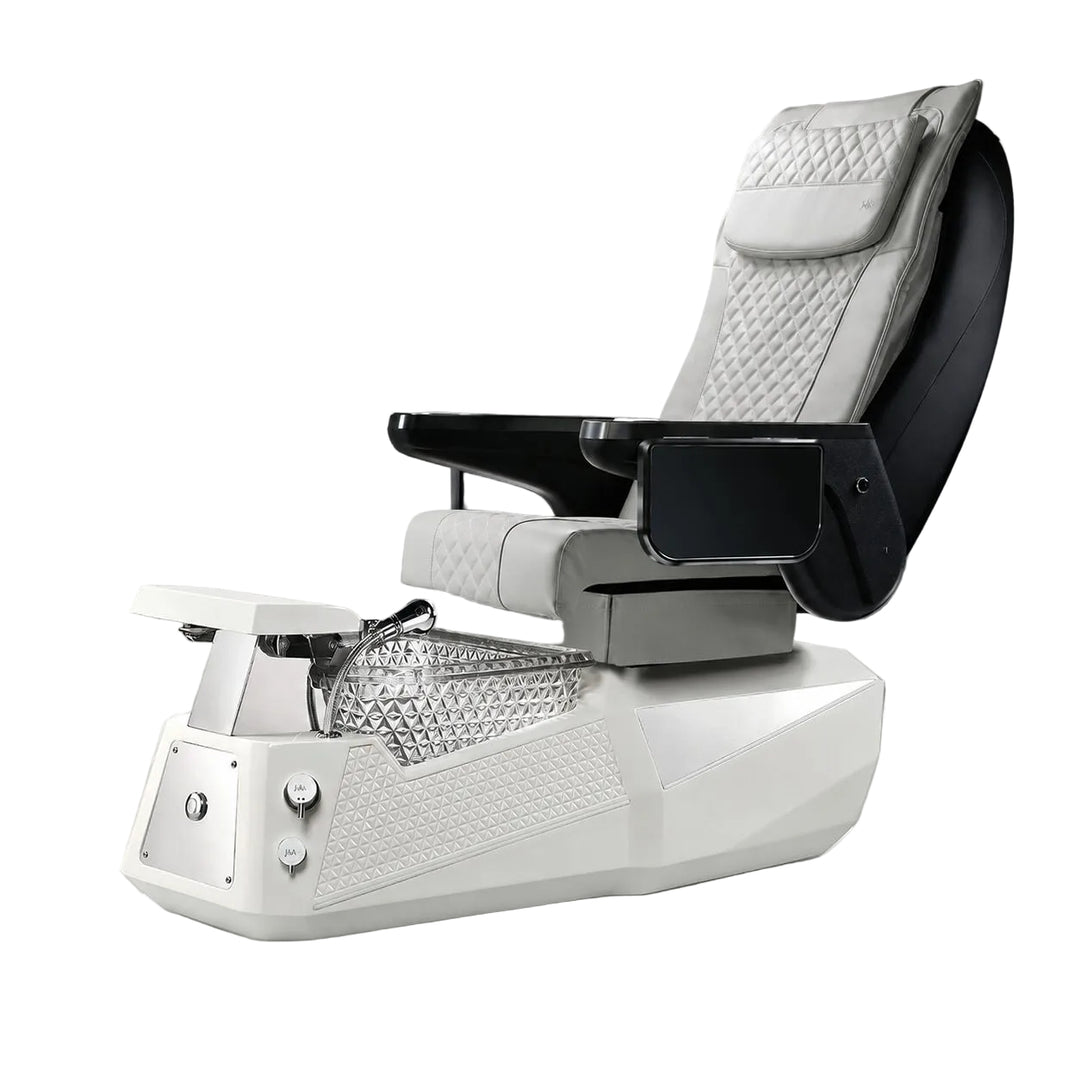 A modern pedicure spa chair with a white base, quilted light gray seat and headrest, black armrests, and a silver foot basin, shown on a neutral gray studio background.