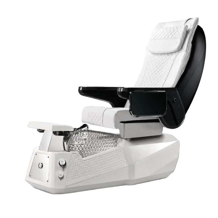 A modern pedicure spa chair with a white quilted seat and headrest, black armrests, and a white base with a clear textured foot basin, shown on a gray studio background.
