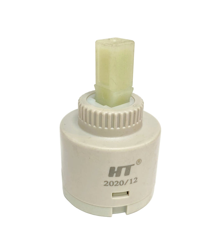 A small cylindrical plastic component with a ribbed top and a translucent pale green rectangular insert, printed with the brand HT and model number 2020/12, on a plain white background.